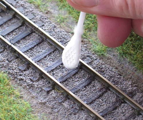 cotton bud to mop up any excess Track Magic.